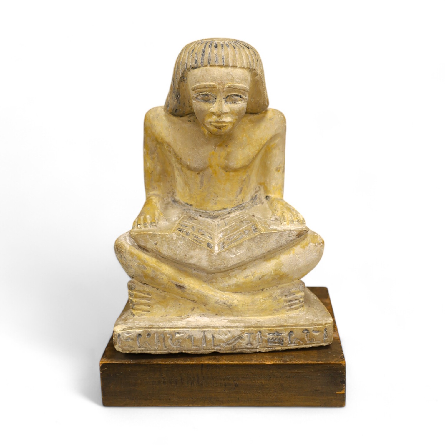 A carved stone Egyptian seated figure on wooden stand, 30cm high not including stand. Condition - fair to good